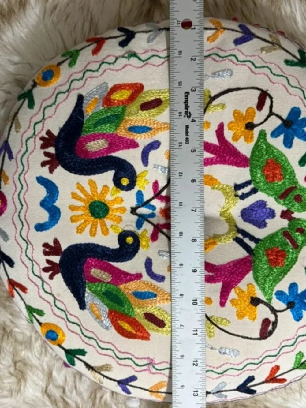 Embroidered round decorative pillow